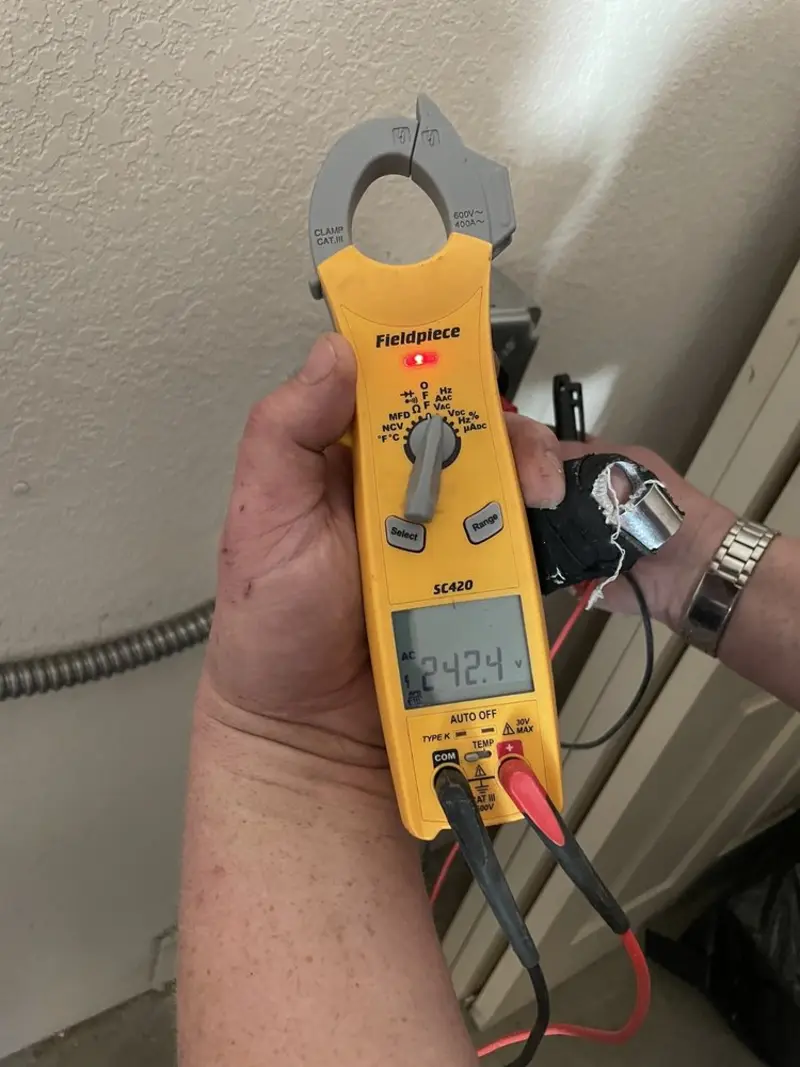 Voltage testing with clamp meter during Whole House Surge Protector in Saukville